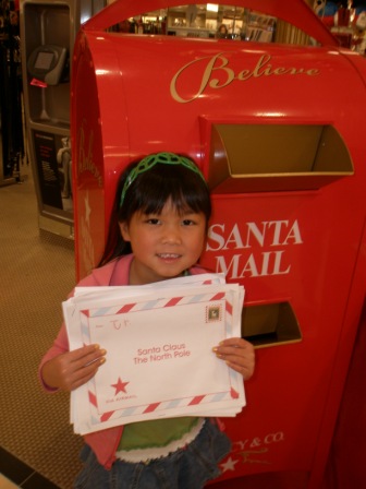 Kasen taking Santa letters to the mailbox